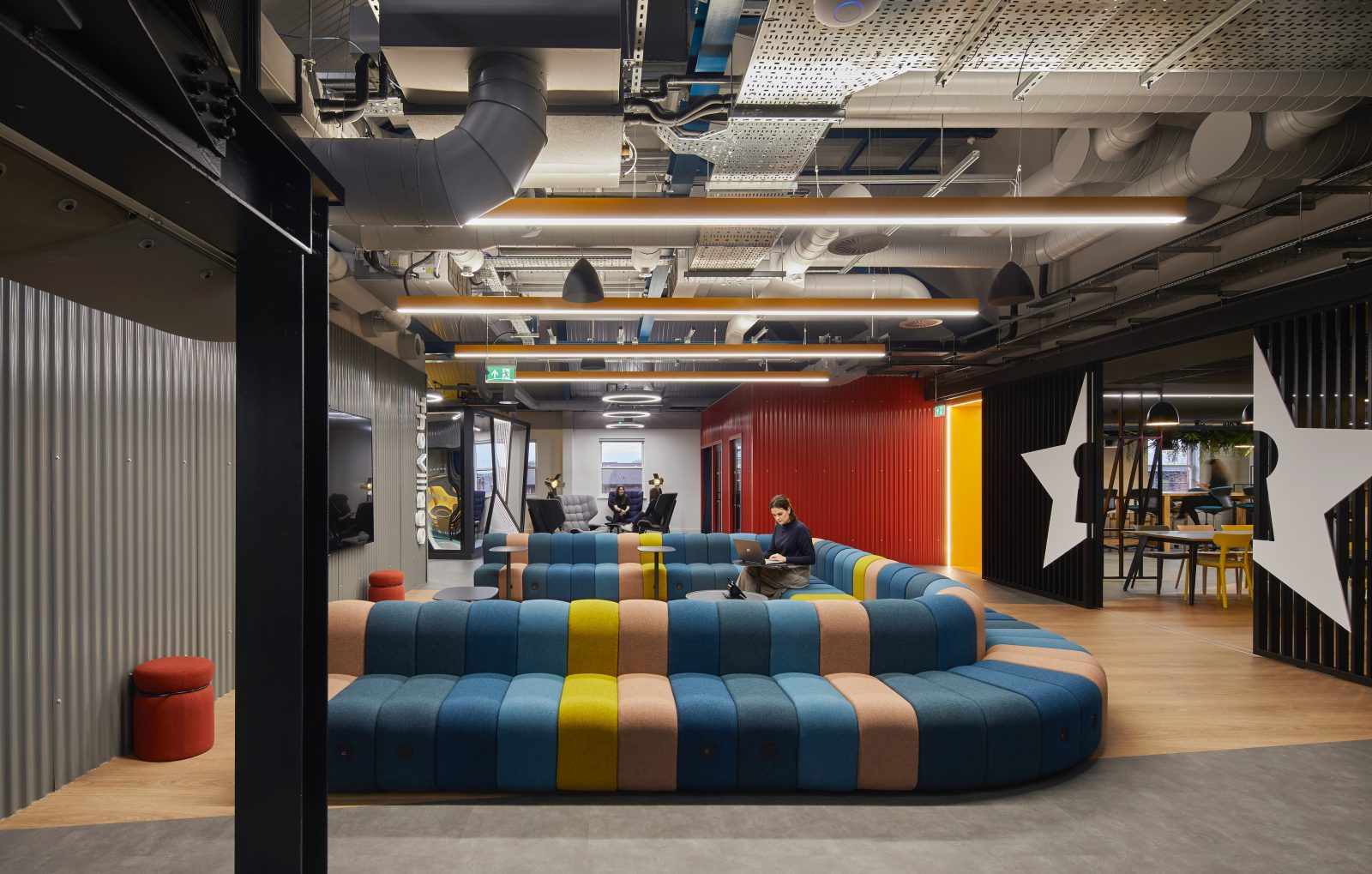 Commercial workplace interior with exposed building services